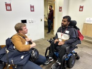 Students chat during a break at C&C