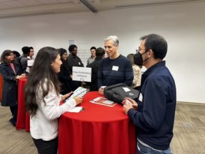 Attendees chat during the career fair