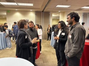 Attendees chat during the career fair at C&C