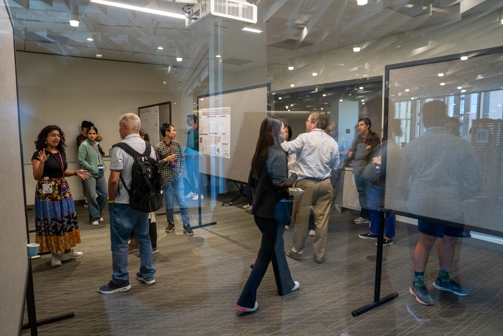 Attendees viewing posters at the 2026 DBDS Retreat.