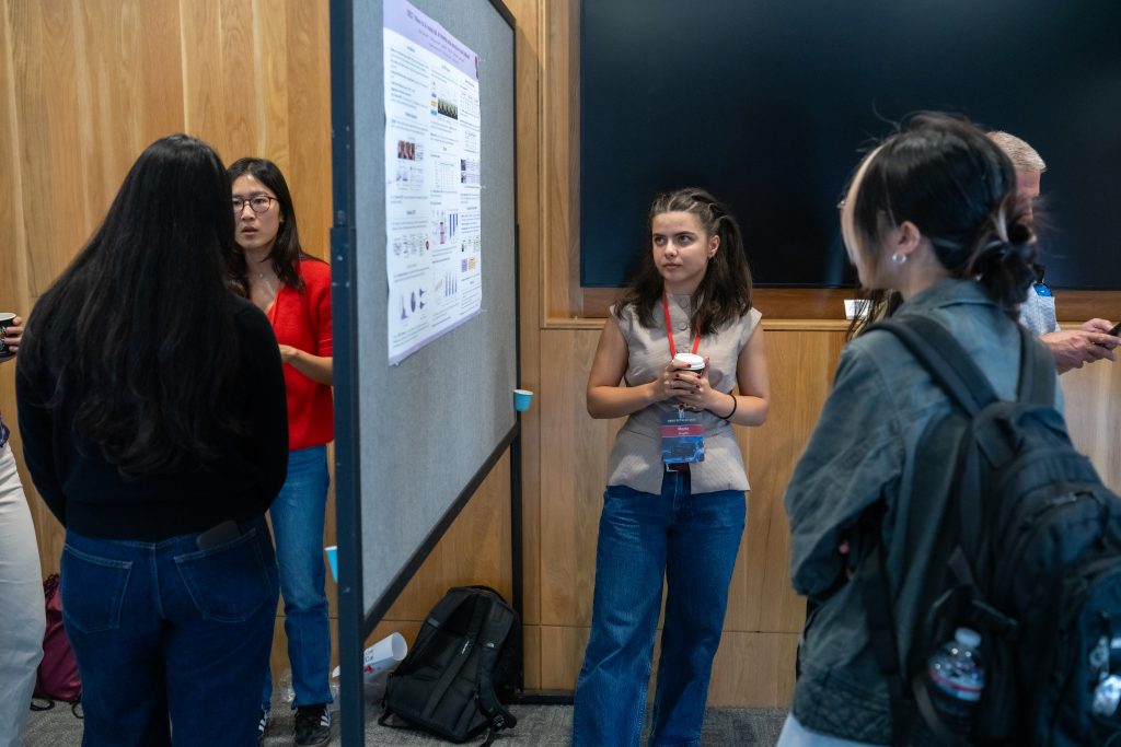 Marie Amale Huynh presenting her poster at the 2026 DBDS Retreat.