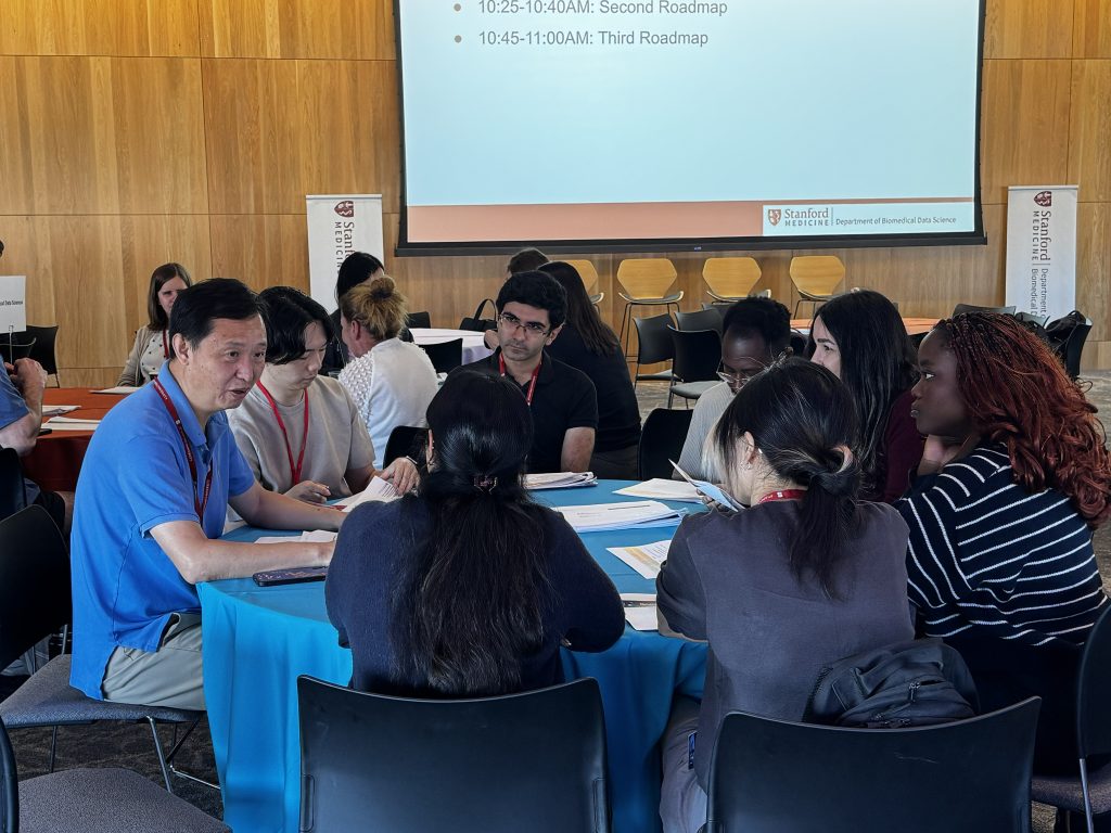Lu Tian speaking with students at the New Student Orientation during the 2026 DBDS Retreat.