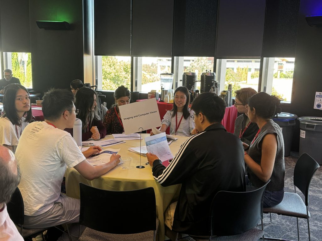 Serena Yeung-Levy speaking with students at the 2026 DBDS Retreat.